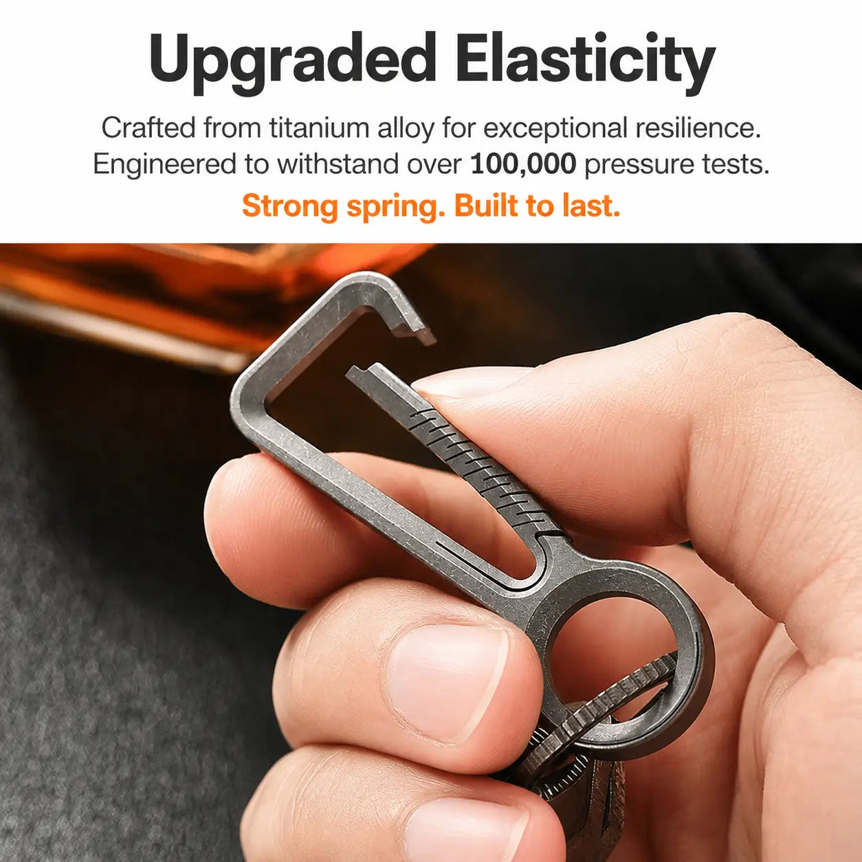 Titanium key holder shown with keys in hand