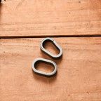 Push-pull titanium key clip shown in hand